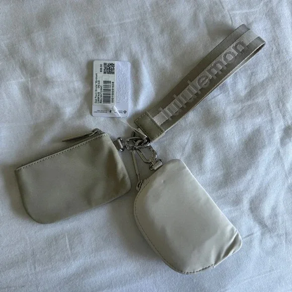 12 🆕 Lululemon Dual Pouch Wristlet Wordmark Raw Linen White Opal